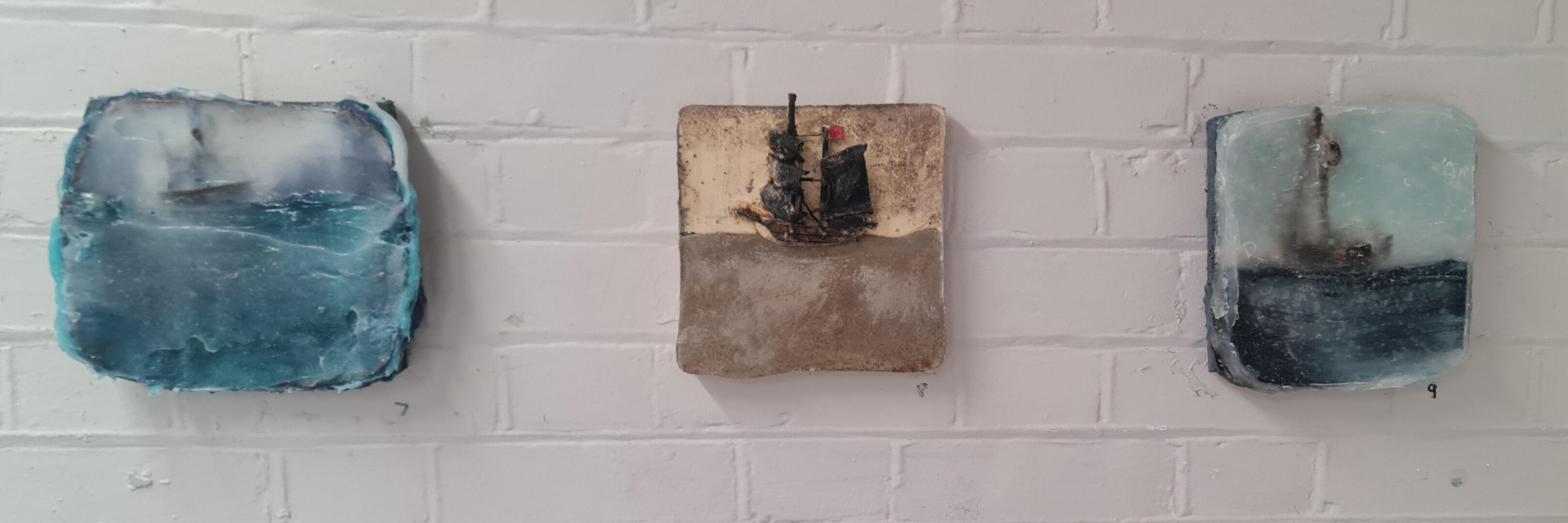 richard elliotts studio wall with 3 paintings
